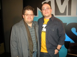 Rick Marshall (Will and Holly) remains a great friend to webcomics, greeting Patton Oswalt for an interview at MTV Splashpage wearing his beloved Overcompensating shirt. Now we just need for Patton to order a mess o' TopatoCo merch and give it to all his friends.